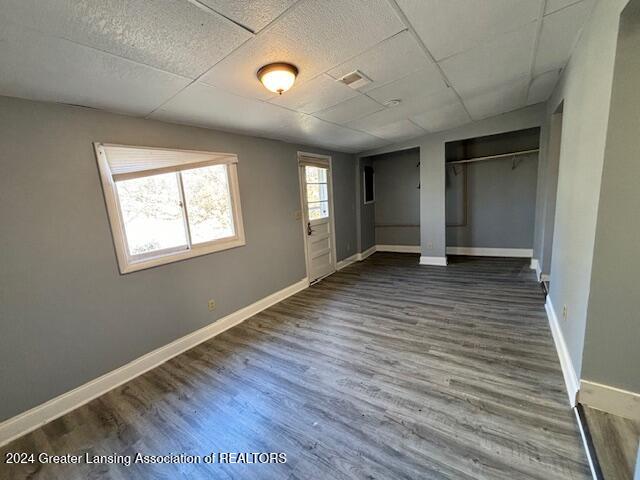 unfurnished bedroom featuring dark hardwood / wood-style flooring