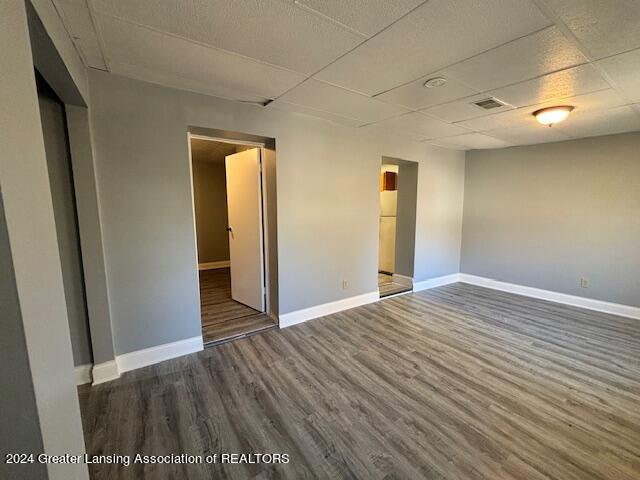 unfurnished bedroom featuring dark hardwood / wood-style flooring