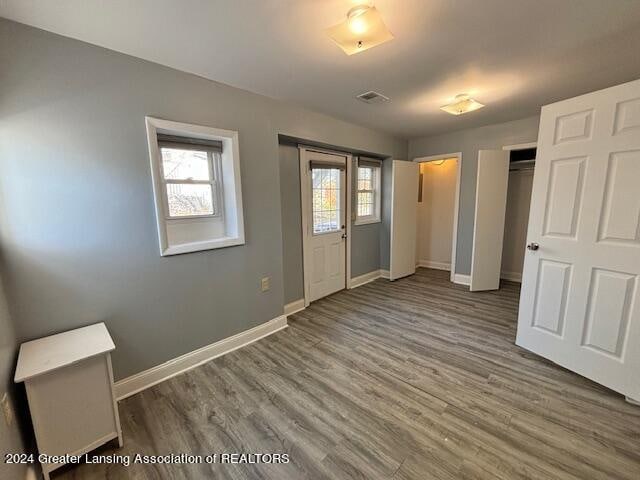 foyer entrance featuring dark wood-type flooring