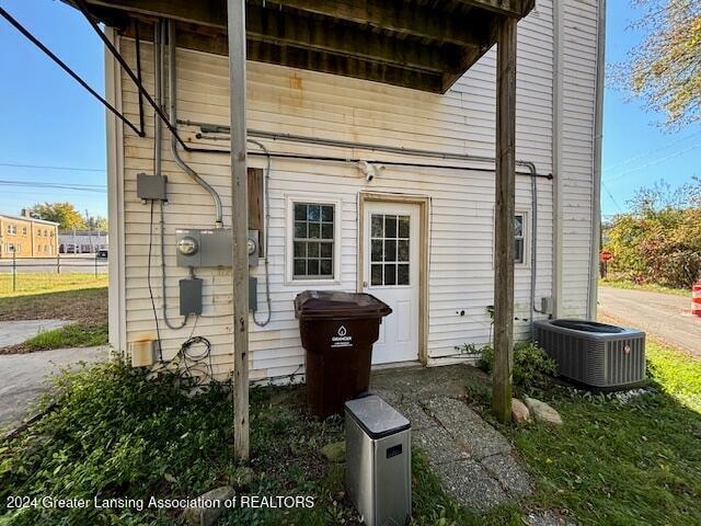 entrance to property featuring central AC