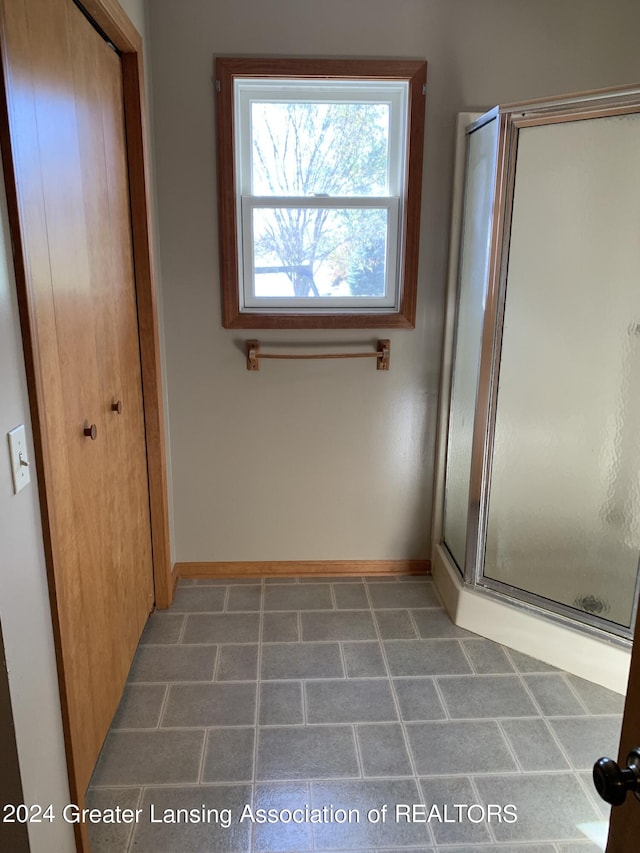 bathroom with an enclosed shower