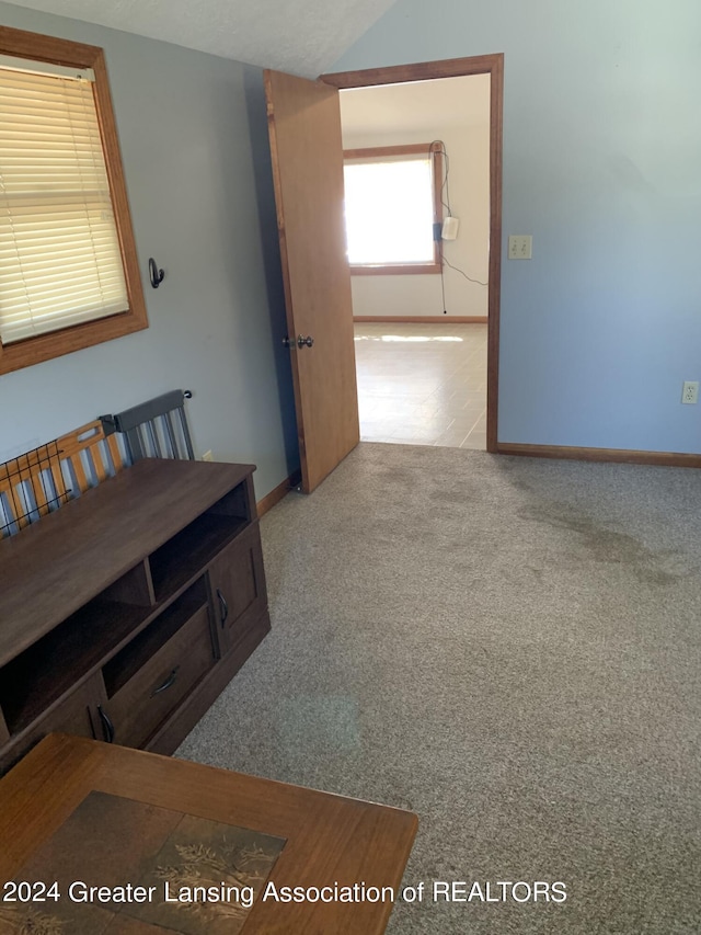 corridor with light colored carpet