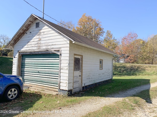 garage with a yard