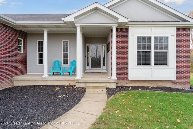 doorway to property with covered porch