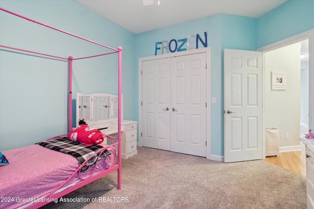 carpeted bedroom with a closet