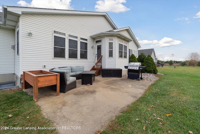 back of property featuring a patio area and a lawn