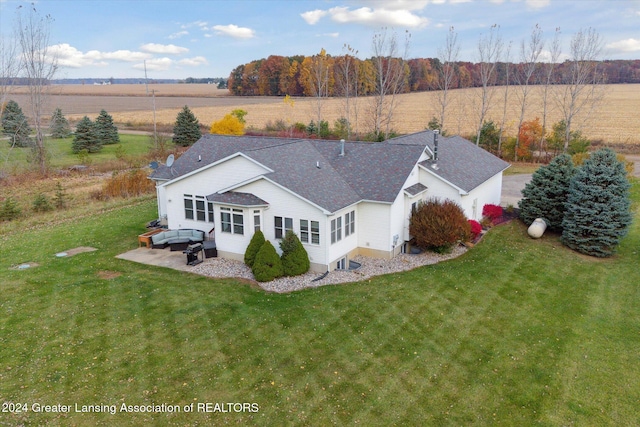 birds eye view of property featuring a rural view