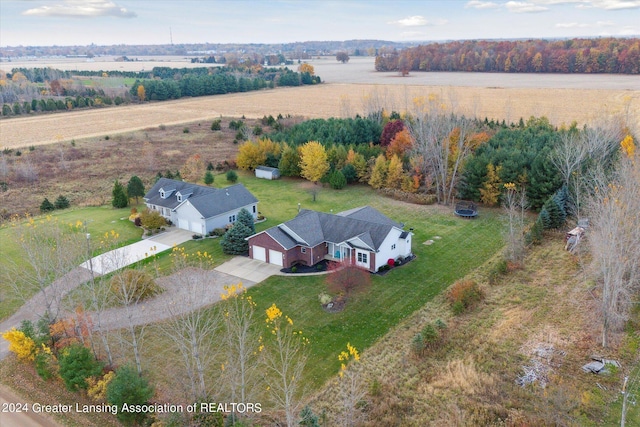 birds eye view of property with a rural view