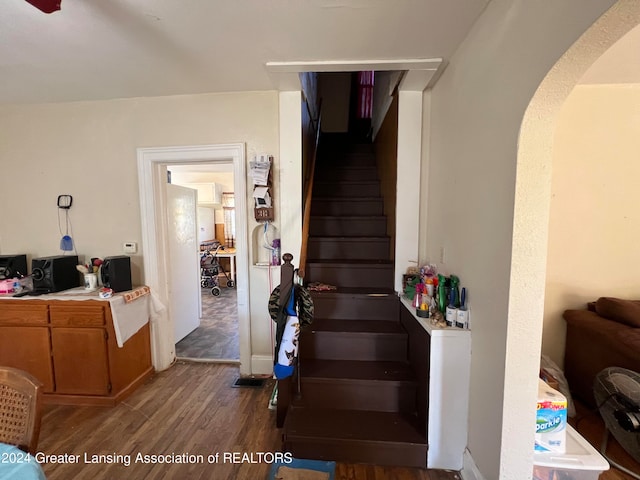 stairs featuring wood-type flooring