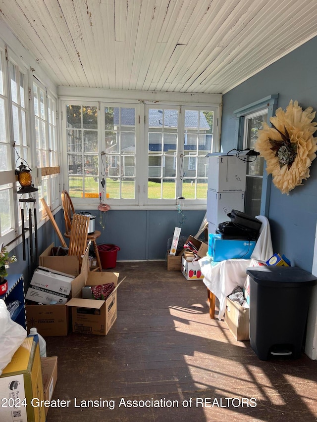 sunroom featuring a healthy amount of sunlight and wooden ceiling