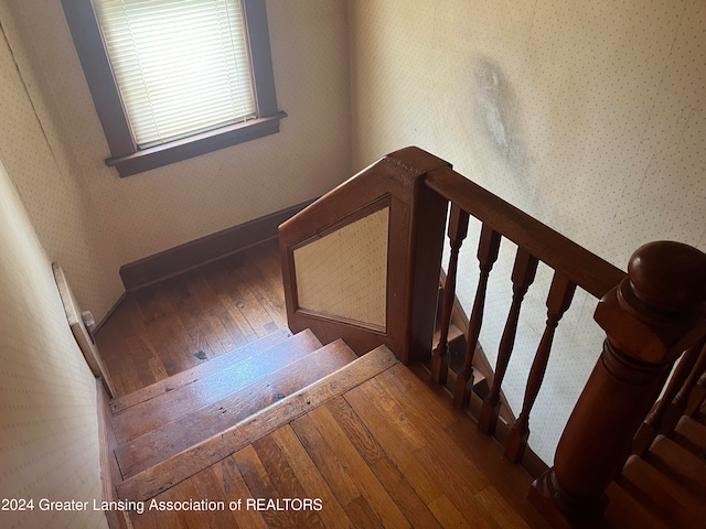 stairs with wood-type flooring