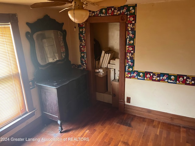 bedroom with ceiling fan and dark hardwood / wood-style flooring