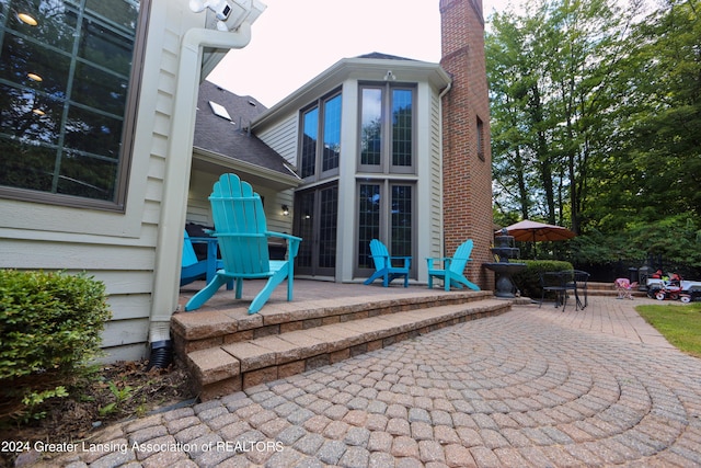 rear view of house featuring a patio