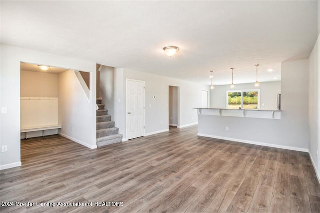 unfurnished living room featuring wood-type flooring