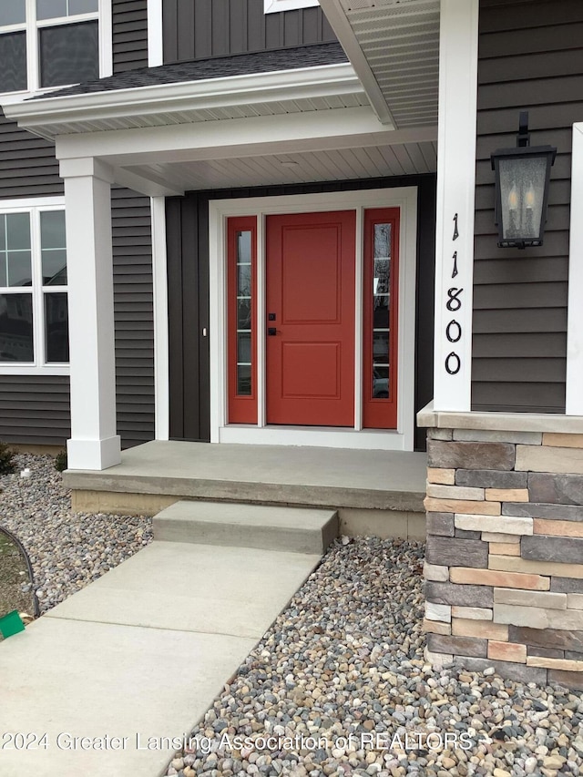 doorway to property with a porch