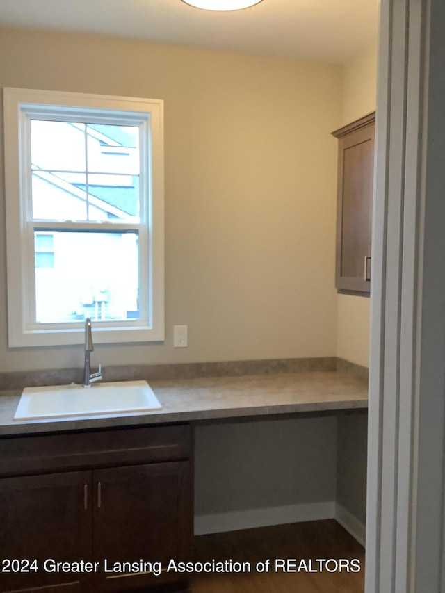 interior space with sink and built in desk