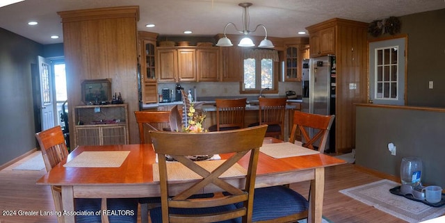 dining area with light wood-type flooring