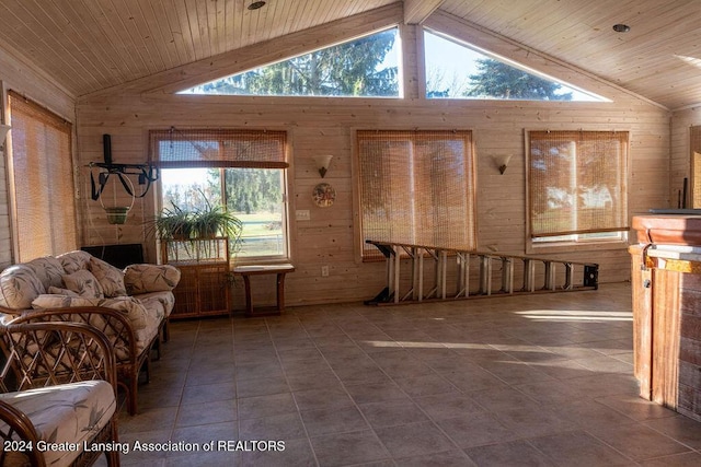 tiled living room featuring beamed ceiling, wooden ceiling, high vaulted ceiling, and wood walls