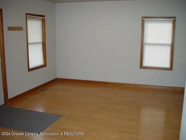 unfurnished room featuring hardwood / wood-style floors