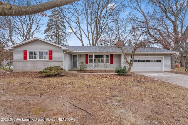 single story home featuring an attached garage, concrete driveway, and brick siding