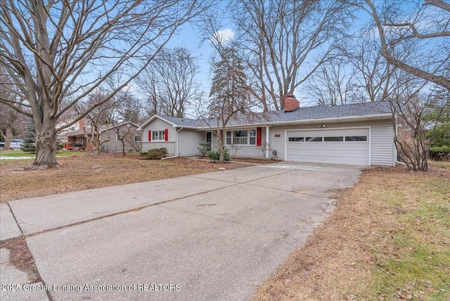 ranch-style house with a garage, aphalt driveway, and a chimney