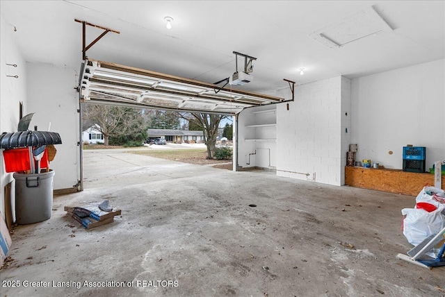 garage featuring a garage door opener