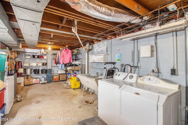 basement featuring sink and washer and clothes dryer