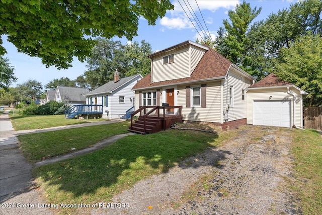 view of front facade with a wooden deck, a garage, and a front lawn