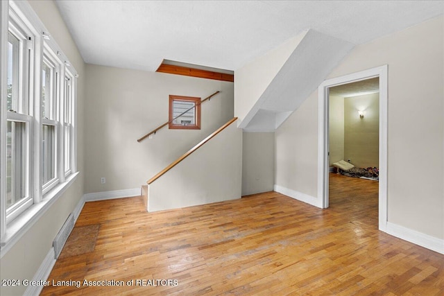 interior space featuring vaulted ceiling and light wood-type flooring