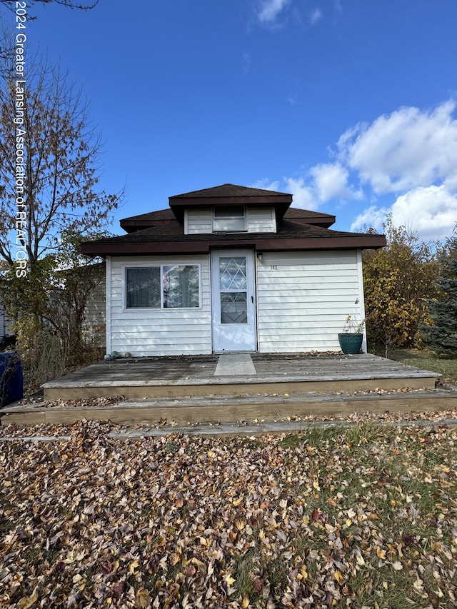 back of property with a deck
