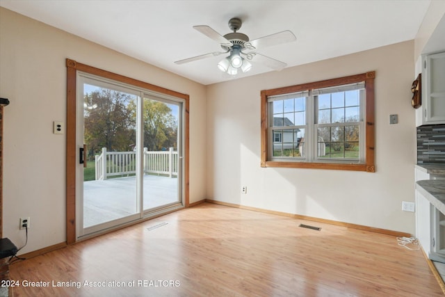 unfurnished living room featuring light wood-type flooring and ceiling fan