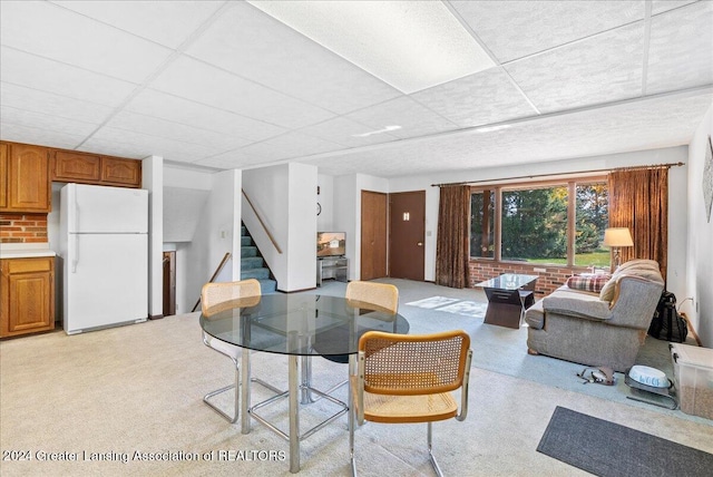 living room featuring a paneled ceiling