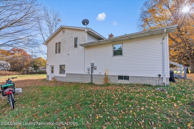 view of home's exterior featuring a lawn