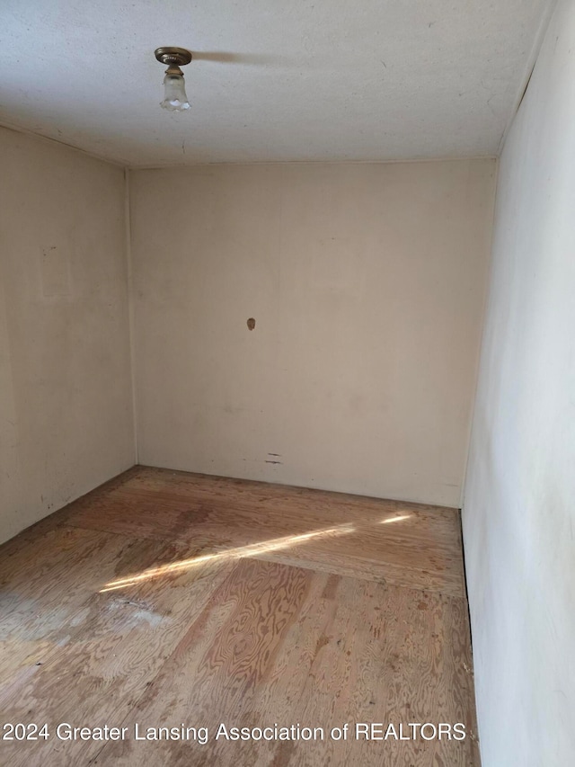 unfurnished room with light hardwood / wood-style flooring