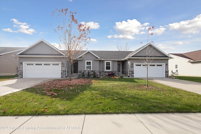 view of front of home featuring a garage and a front lawn