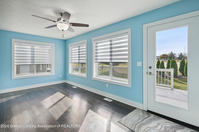 interior space featuring dark hardwood / wood-style floors and ceiling fan