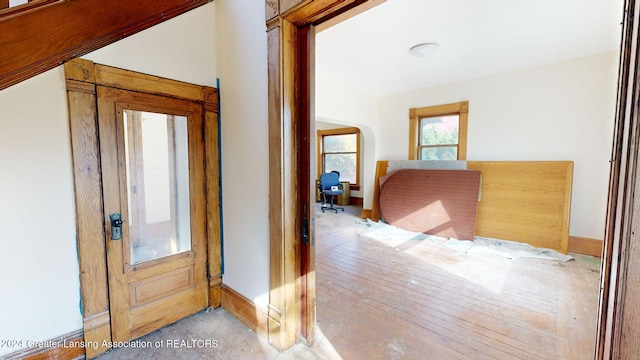 corridor with light hardwood / wood-style flooring