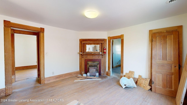 unfurnished living room featuring light wood-type flooring