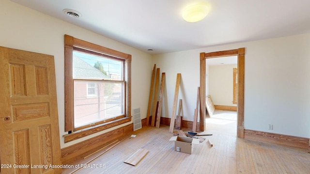 empty room with light hardwood / wood-style floors