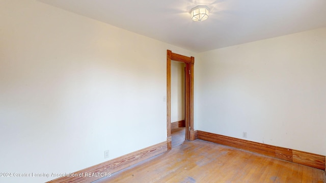 spare room with light hardwood / wood-style floors