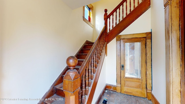 staircase with carpet flooring