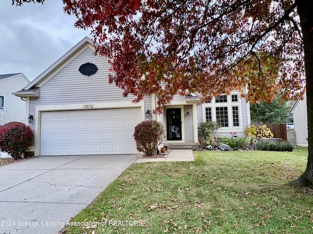 front of property with a front lawn and a garage