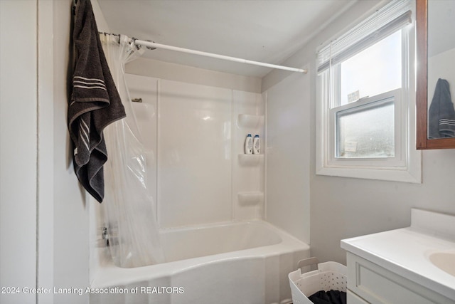 bathroom with vanity and shower / bathtub combination with curtain