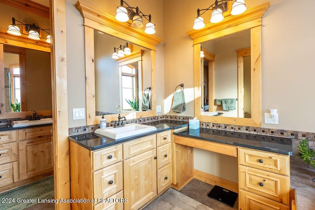 bathroom with vanity and tasteful backsplash