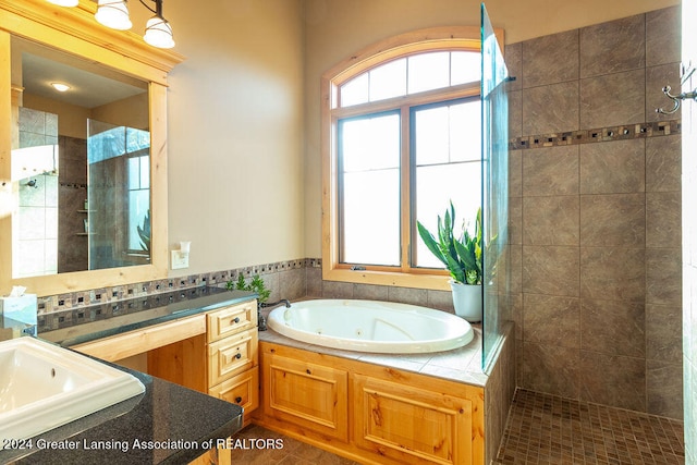 bathroom with vanity and plus walk in shower