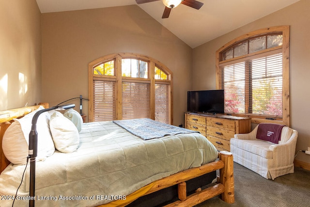 bedroom featuring lofted ceiling, multiple windows, carpet floors, and ceiling fan