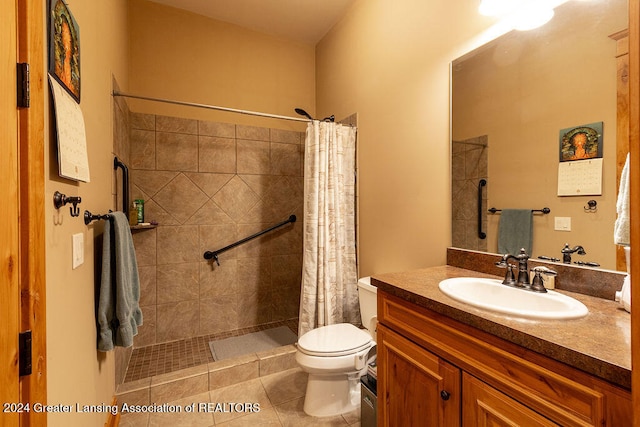 bathroom with vanity, a shower with shower curtain, toilet, and tile patterned floors