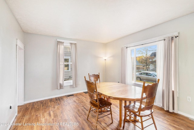 dining room with hardwood / wood-style floors