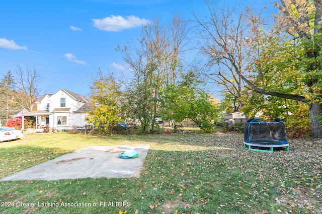 view of yard with a patio area and a trampoline