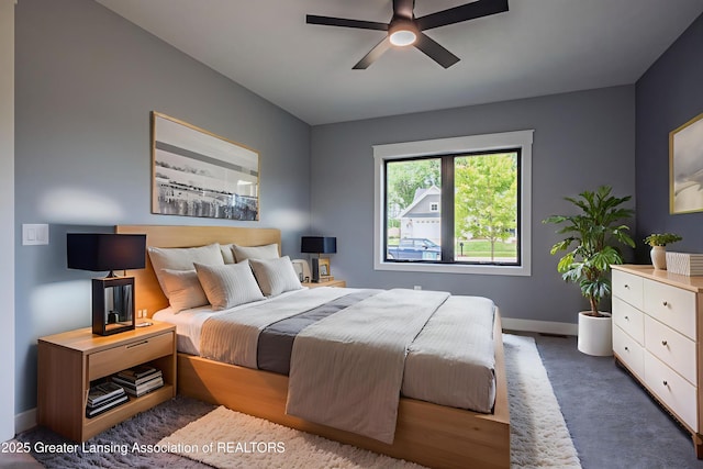 6119 Fresno Ln, East Lansing, MI 48823 - carpeted bedroom with baseboards and ceiling fan